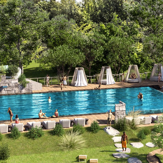 Urlaub in Südtirol im Hotel mit Pool am See Schwimmbad mit Gästen und Liegestühlen umgeben von Bäumen und Wiese
